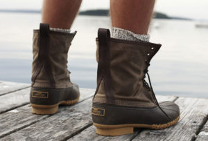 guy wearing boots on dock